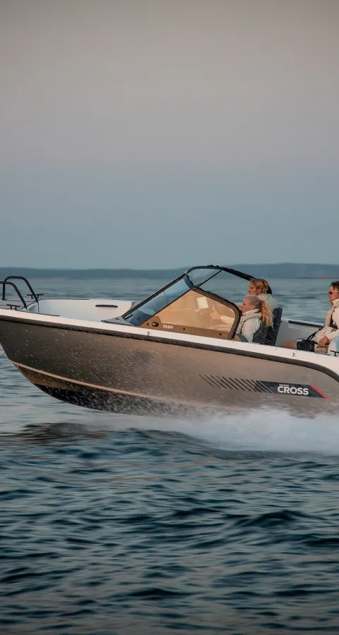 Yamarin Cross 55 BR open aluminium boat driving at the sea sunset